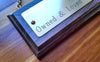 Engraved Brass Name Plate on Solid Walnut Plaque detail