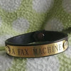 engraved brass plate on rider's bracelet
